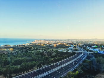 High angle view of cityscape against clear blue sky