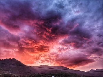 Scenic view of dramatic sky during sunset