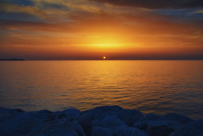 Scenic view of sea at sunset