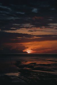 Scenic view of sea against sky at sunset