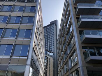 Low angle view of modern buildings against clear sky