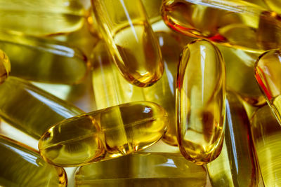 Close-up of cod liver oil capsules on table