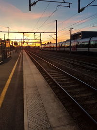 Train at railroad station against sky