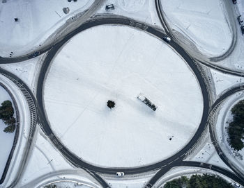 Round road junction in snowy countryside