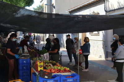 People at market stall