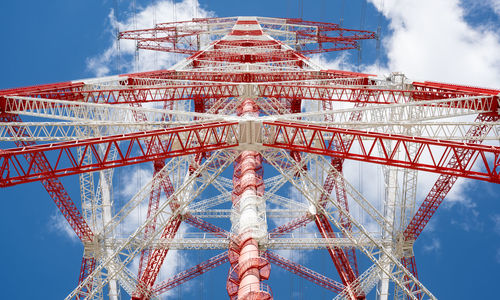 Low angle view of ferris wheel against sky