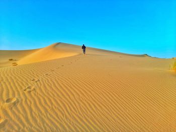 Scenic view of desert against clear sky