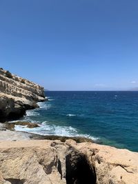 Scenic view of sea against clear blue sky