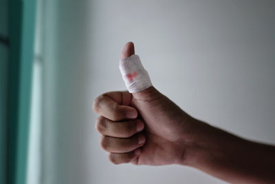 Close-up of man holding hands
