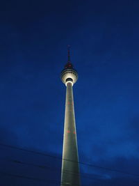 Low angle view of fernsehturm against sky at night