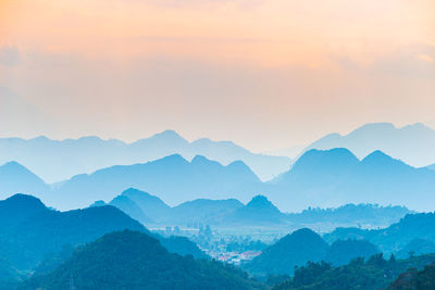 Scenic view of mountains against sky during sunset