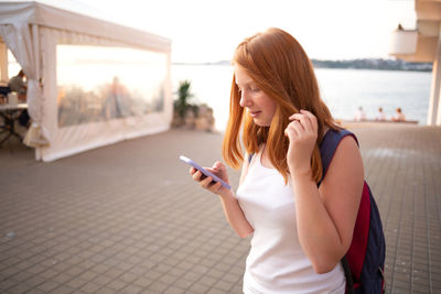 Young woman using mobile phone