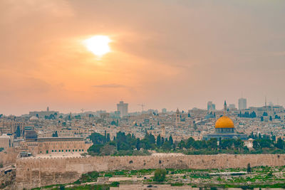 View of cityscape against sky during sunset