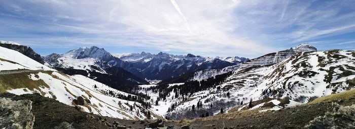 Scenic view of snowcapped mountains against sky