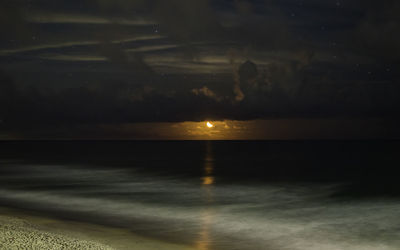 Scenic view of sea against sky at sunset