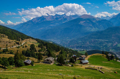 Scenic view of landscape and mountains against sky