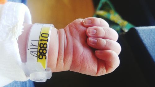 Close-up of hand holding text