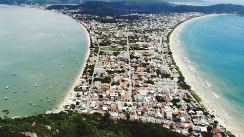 High angle view of townscape by sea