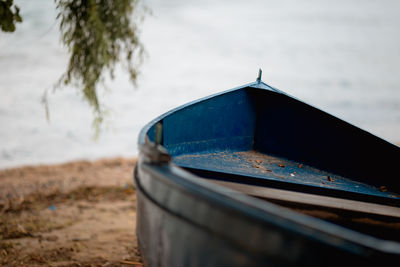 Close-up of boat on beach