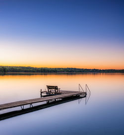 Lake woerthsee with jetty in bavaria, germany in autumn