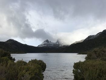 Scenic view of lake and mountains against sky