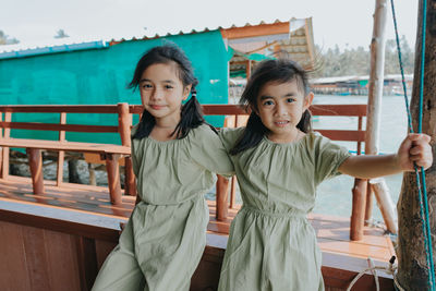 Portrait of smiling girl standing outdoors