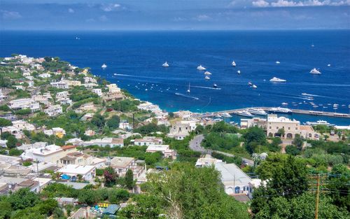 High angle view of townscape by sea