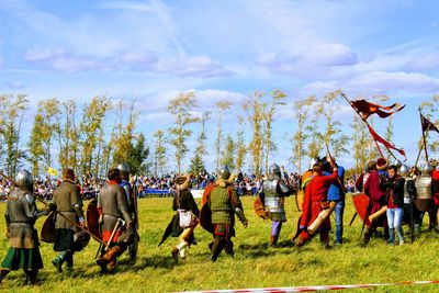 People on field against sky