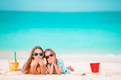 Portrait of young woman with ice cream at beach