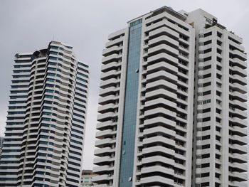 Low angle view of modern buildings against sky