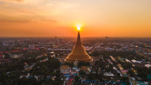 A massive golden pagoda located in the sunset community of phra pathom chedi, nakhon thailand