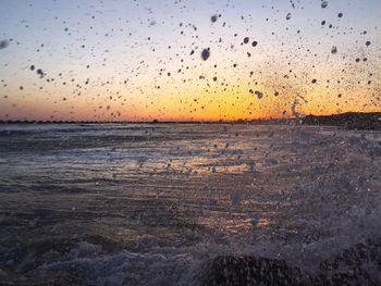 Scenic view of sea at sunset