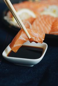 Close-up of fork in plate on table