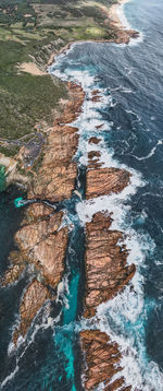 High angle view of rocks in sea