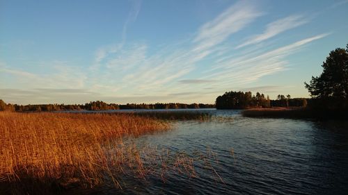 Scenic view of landscape against sky at sunset