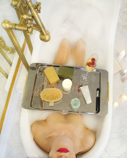 High angle view of woman in bathtub