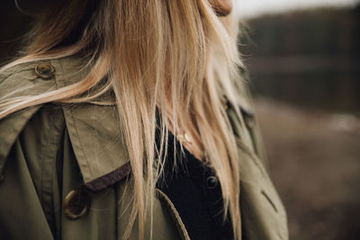 Midsection of woman standing outdoors