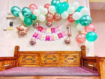 High angle view of multi colored balloons on table at home