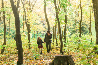 People standing in forest during autumn