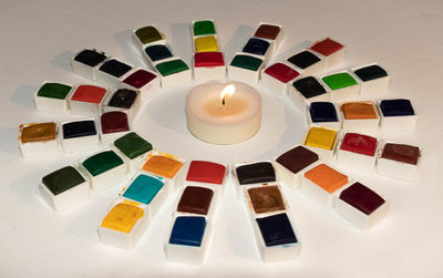 High angle view of tea light candles on table