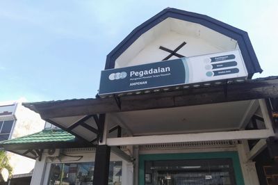 Low angle view of information sign against sky