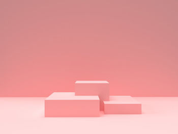 Close-up of white box against pink background