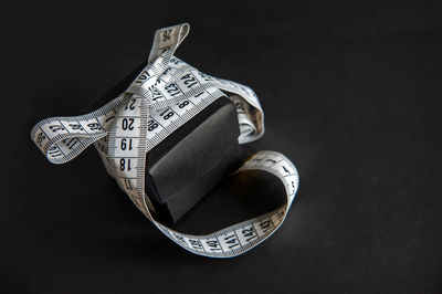 Close-up of electric lamp over black background