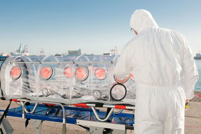 Rear view of man working at construction site