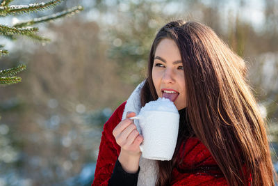 Portrait of a smiling young woman in winter