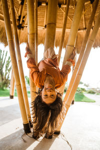 Portrait of boy playing on slide at playground