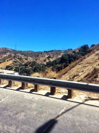 Scenic view of mountains against clear blue sky
