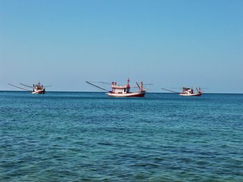 Boats sailing in sea