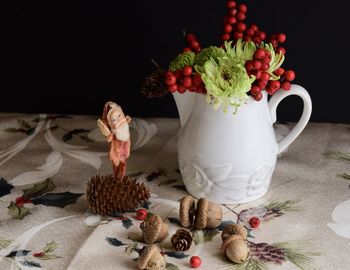 Close-up of roses in vase on table