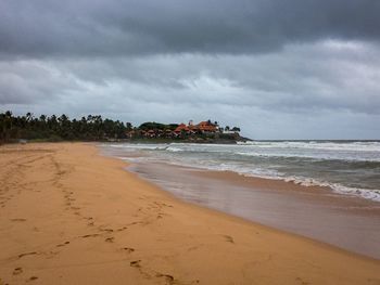 Scenic view of beach against sky